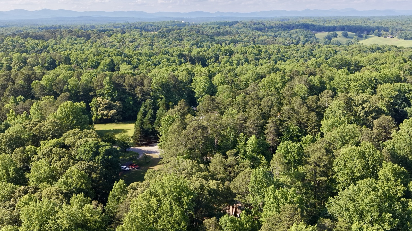Aerial of property nestled in forest
